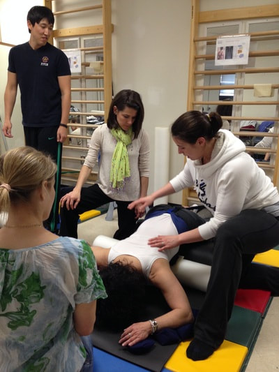 Physical Therapists in a class to learn how to treat scoliosis patients Picture